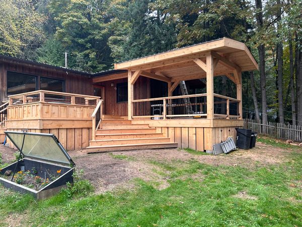 Cedar deck and stairs with a timber-framed covered pavilion