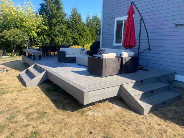 Gray composite deck with two levels and wide stairs